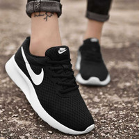 NIKE 耐克 Nike耐克女鞋 TANJUN 经典黑白网面透气跑步鞋轻便休闲运动鞋