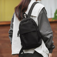 小型双肩包女旅游轻便2024迷你旅行小号背包通勤运动爬山书包 黑色【带白毛球精挂件】